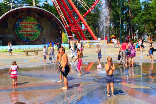 children rescued from the heat by bathing in fountains Gorky Park in Kharkiv