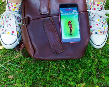 Dnipropetrovsk, Ukraine - July 23, 2016: The phone with game Pokemon GO - a free-to-play augmented reality mobile game developed by Niantic for iOS and Android devices.