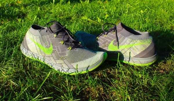 Dnipropetrovsk, Ukraine - August, 21 2016: New style nike shoes on green grass in park - illustrative editorial