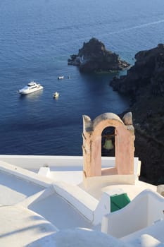 White house and and bell tower in Oia. Santorini