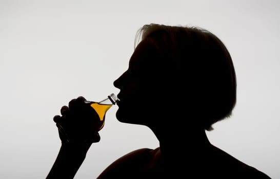 Woman drinks schnapps