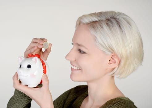 Woman with piggy bank