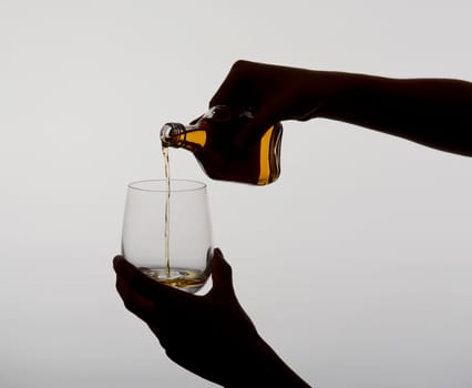 Woman pours liquor