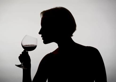 Woman drinks red wine