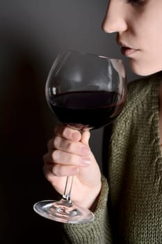 Woman drinks red wine
