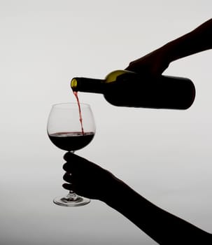 Woman pours wine