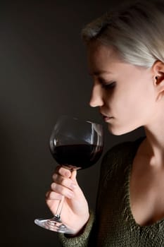 Woman drinks red wine