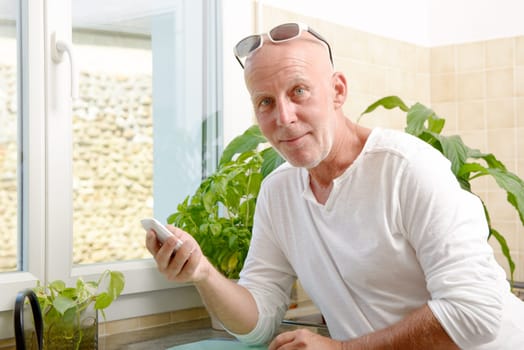 a middle-aged man with a mobile phone