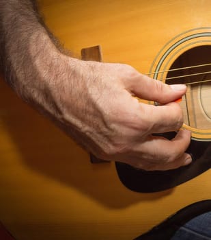 Practicing in playing guitar. The old men playing guitar
