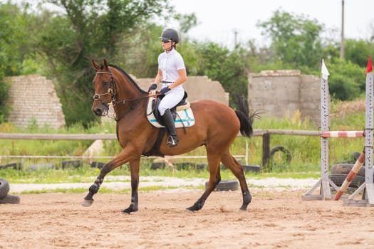 Volgograd, Russia - June 19, 2016: Athlete warming up before a horse jumping competitions in show jumping