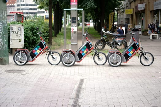Berlin,Germany - June 21,2016: Bicycles or tricycles are lined up one after the other at a bicycle rental at the Nikolaiviertel on June 21,2016 in Berlin.
