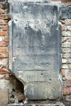 Berlin,Germany - June 21,2016: An old worn and almost destroyed memorial plaque on a wall of the Nikolaikirche in the Nikolaiviertel on June 21,2016 in Berlin.