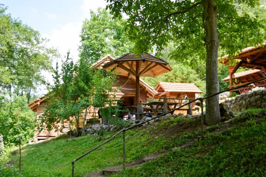small ethno restaurant in the woods. Shoot from outside and lower angle