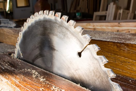 CLose up of machine with circular saw in the carpenter workshop