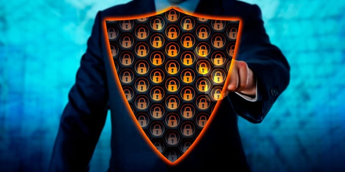 Businessman activating a virtual antivirus shield covering his chest. Cybersecurity metaphor and information technology concept for a virtual firewall, network defense and virus removal. Copy space.
