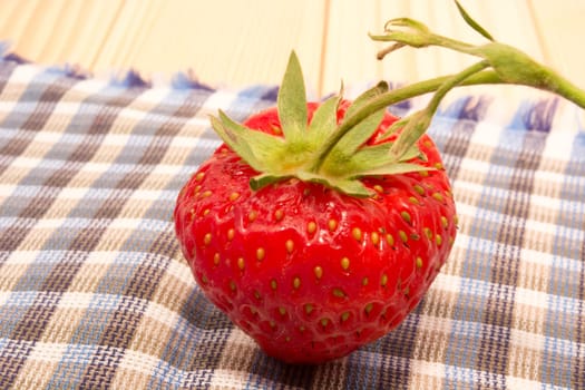 Fresh strawberry laying on napkin