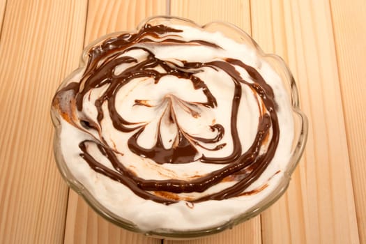 Vanila and chocolate desert in glass pot