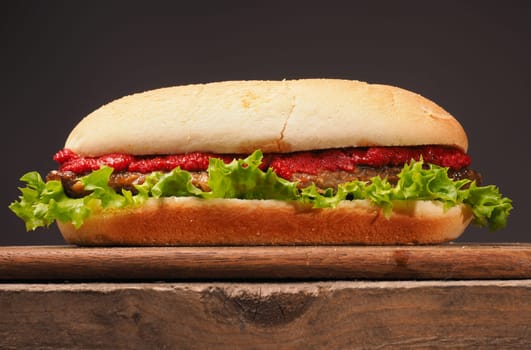 Delicious burger on a rustic wooden table