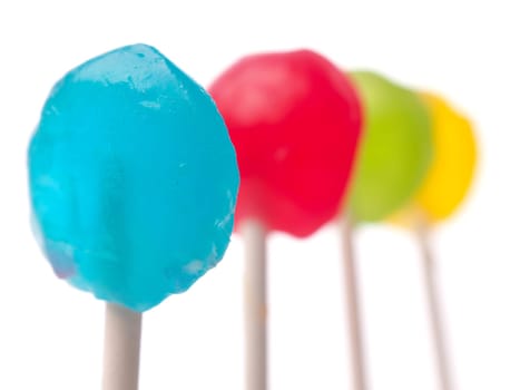 Colorful lollypop in a row selective focus on foreground