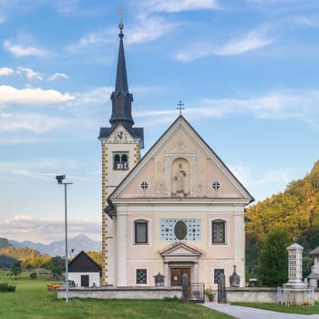 Traditional catholic church in Bohinjska bela village, near Bled, Slovenia.