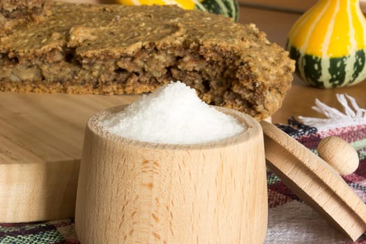 Just baked, fresh, domestic unleavened barley bread on the wooden plate, cutted in half