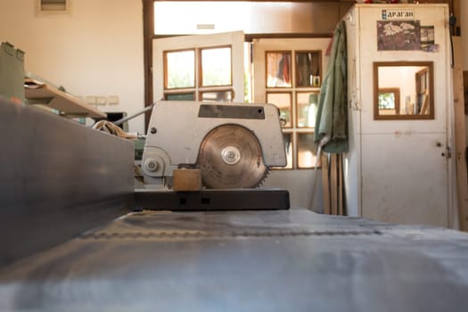 Circular saw in carpenters workshop