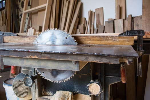 Circular saw in carpenter workshop