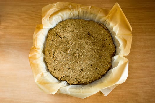 Just baked, fresh, domestic unleavened barley bread on the kitchen table