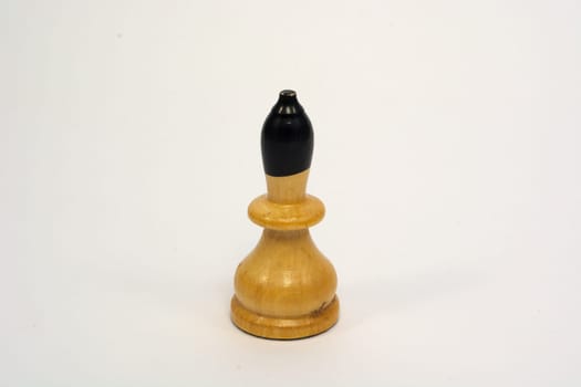Old wooden chess piece white bishop isolated on white background