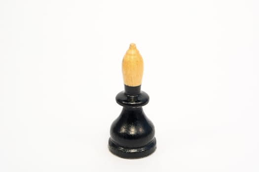 Old wooden chess piece black bishop isolated on white background