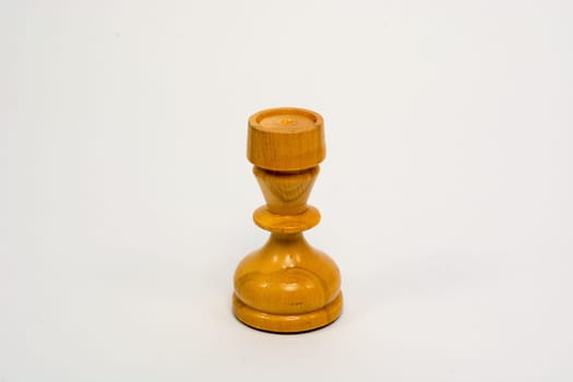Old wooden chess piece white rook isolated on white background