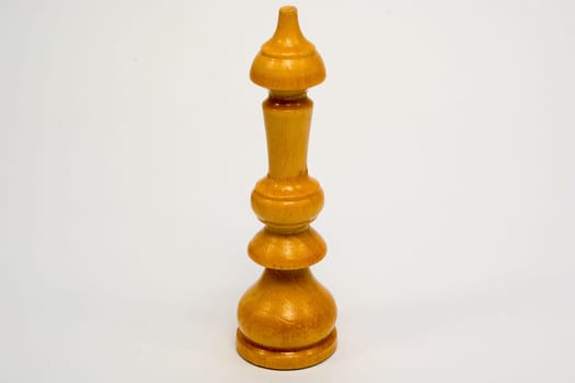 Old wooden chess piece white King isolated on white background