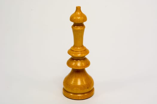 Old wooden chess piece white queen isolated on white background