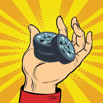 Hand with car tires pop art retro comic book vector illustration. sale of spare parts