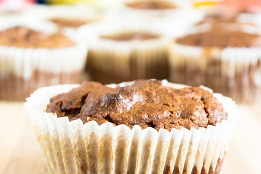 Just baked sweet chocolate cupcakes still in bake tray.
