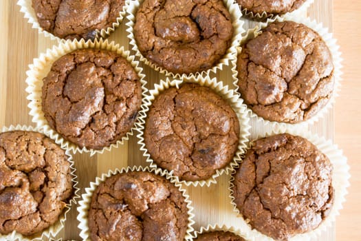 Just baked sweet chocolate cupcakes still in bake tray.