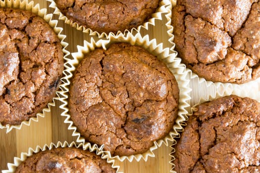 Just baked sweet chocolate cupcakes still in bake tray.