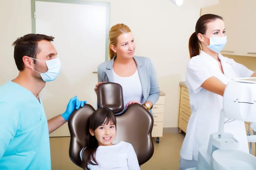Little girl with her mother at the Dentist before treatment..