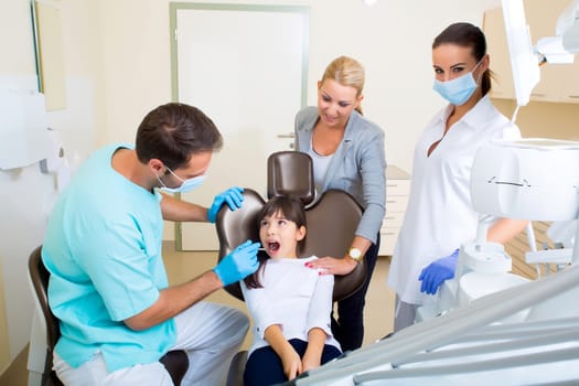 Little girl with her mother at the Dentist before treatment..
