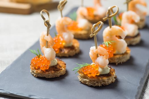 Shrimp Appetizer served on toasted bread with golden Caviar
