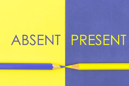 Absent versus Present contrast concept . Yellow and Violet coloured pencils and paper.