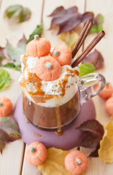 Glass cup Caffe latte with kuerbis flavor and cinnamon for Halloween