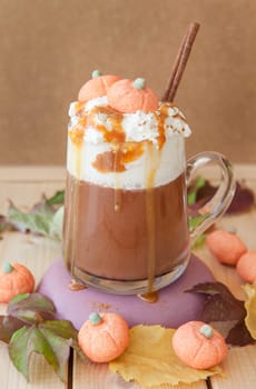 Glass cup Caffe latte with kuerbis flavor and cinnamon for Halloween