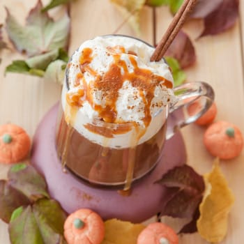 Glass cup Caffe latte with kuerbis flavor and cinnamon for Halloween