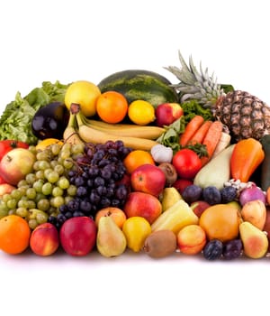 Collection of fruits and vegetables on white background.