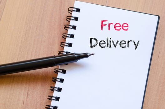 Free delivery text concept write on notebook
