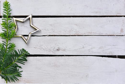 Christmas stars natural decoration on white wood background