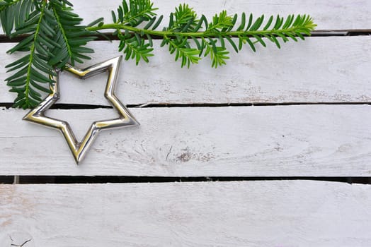 Christmas stars natural decoration on white wood background