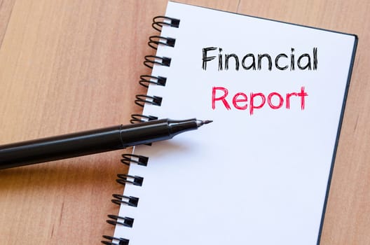 Financial report text concept write on notebook
