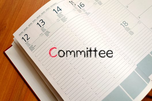 Committee text concept write on notebook